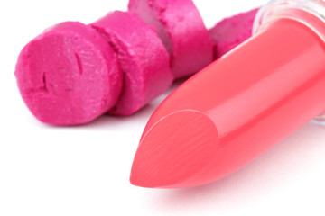 Red lipstick and rose cuted lipstick on white