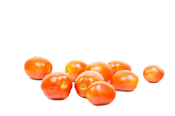 Some fresh tomatoes on white