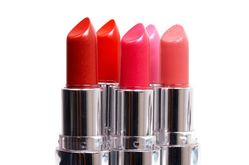 Five lipsticks on white