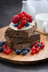 chocolate brownie cake with nuts and fresh berries 