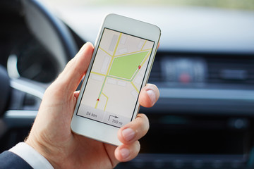 Man sitting in the car with mobile phone