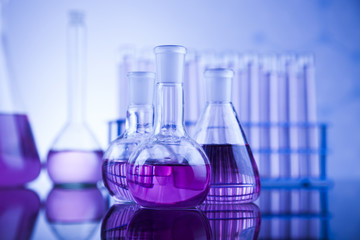 Laboratory work place with microscope and glassware