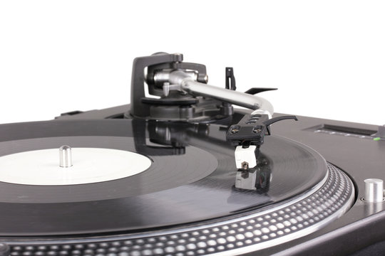 Turntable with dj needle on spinning record