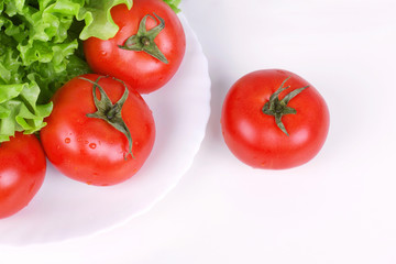 Tomatoes and salad leaf