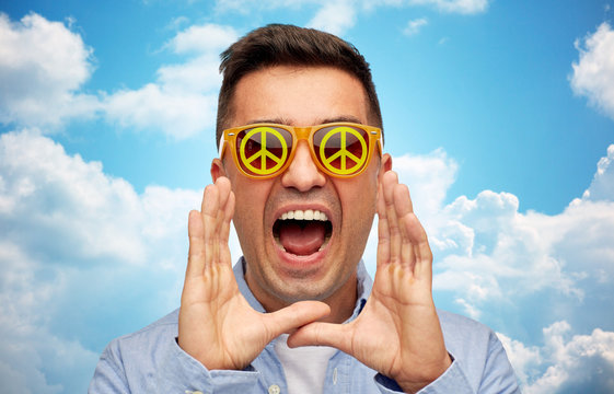 Face Of Shouting Man In Green Peace Sunglasses