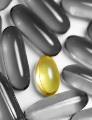 Fish oil and food supplement  pills macro vertical