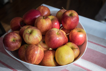 Apples in basket on the table.