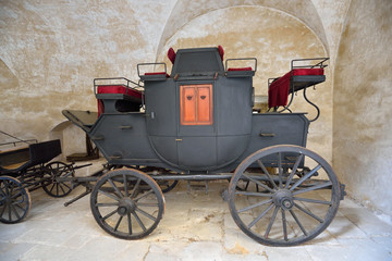 Fototapeta na wymiar Well-preserved historic black carriage