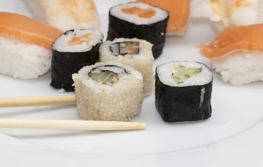 Different japanase sushi rolls with chopstic