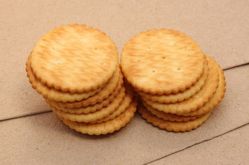 crackers on brown paper background