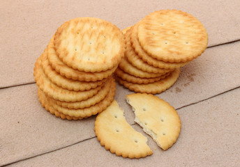 crackers on brown paper background