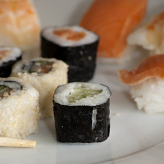 Different japanase sushi rolls with chopstic