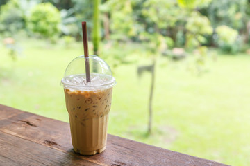 Ice coffee on table in cafe