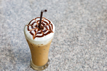Ice coffee on table in cafe