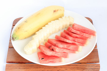 slice fruits (bananas and watermelon) put on plate