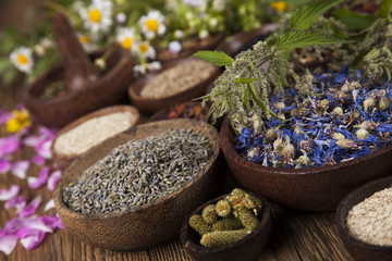Obraz na płótnie Canvas Natural remedy,Herbal medicine and wooden table background
