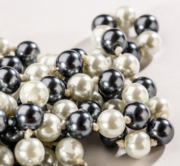 String of black and white pearls