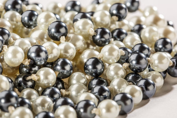 String of black and white pearls