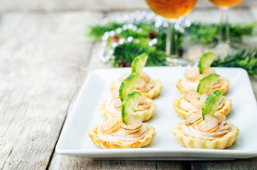 tartlets with salmon mousse, shrimp and cucumber for the New yea