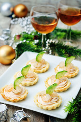 Fototapeta na wymiar tartlets with salmon mousse, shrimp and cucumber for the New yea