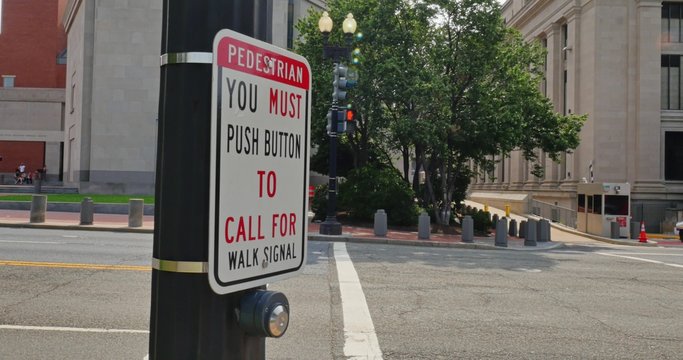 Pedestrian Presses Crosswalk Button