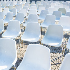 White plastic chairs waiting for audience at an open-air event © alan_p