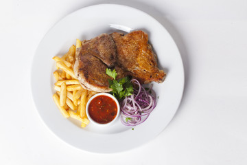 meat with fries and red onion sauce