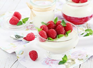 Panna cotta with fresh raspberries. Selective focus.