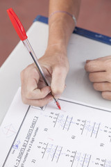 the teacher checking the homework