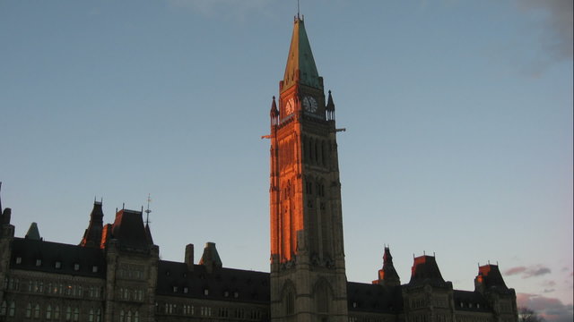 Parliament Hill Ottawa Time Lapse 3. Late afternoon time lapse shot of the Centre Block building, on Parliament Hill in Ottawa Canada. Tilting up.