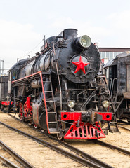 Fototapeta na wymiar old black steam locomotive in Russia 