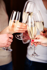Woman hands with glasses of champagne