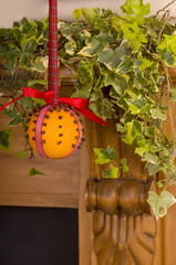 Christingle Orange Hanging on a Fire surround

