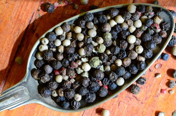 Black, green, red and white pepper