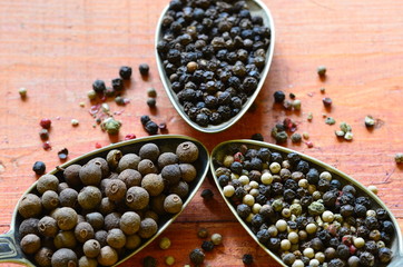 Black, green, red and white pepper