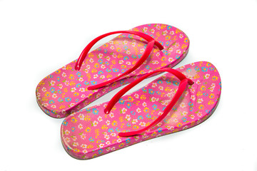 Used pink slippers on white background.