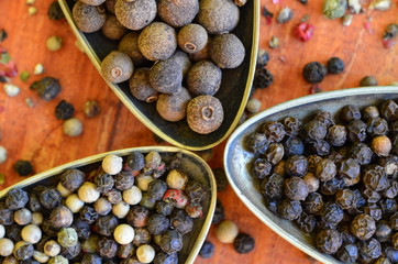 Black, green, red and white pepper