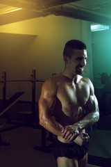 Fototapeta na wymiar Showing abdominal muscles in gym