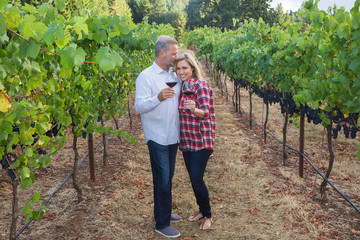 Happy couple at a wine vineyard