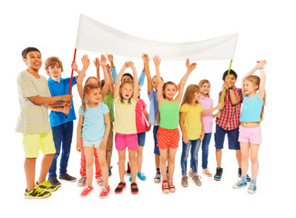 Fototapeta premium Many kids stand with blank banner