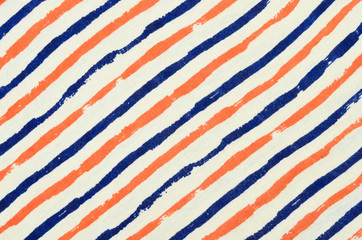 Blue and orange striped background. Diagonal stripes pattern on fabric.