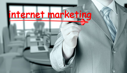 business man writing internet marketing