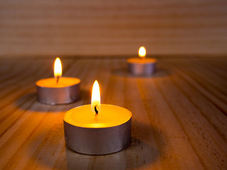 Obraz na płótnie Canvas candle in meditation placed on wooden floor