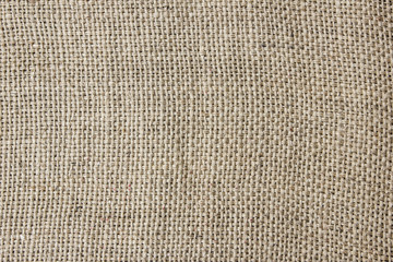 Brown linen fabric texture background. Vintage retro flour bag pattern.
