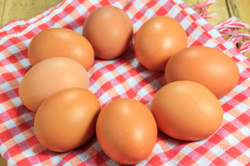 The eggs and cloth on the  wood background.