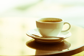 hot coffee on table. vintage filter.