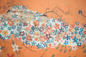 Part of old flower flora mural painting pattern art on a messy crack wall background