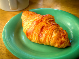 A poor’s man breakfast, just a croissant and a cup of coffee