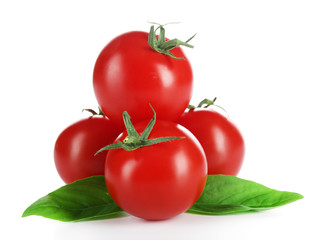 Cherry tomatoes with basil isolated on white