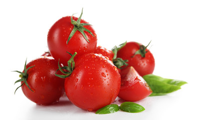 Cherry tomatoes with basil isolated on white